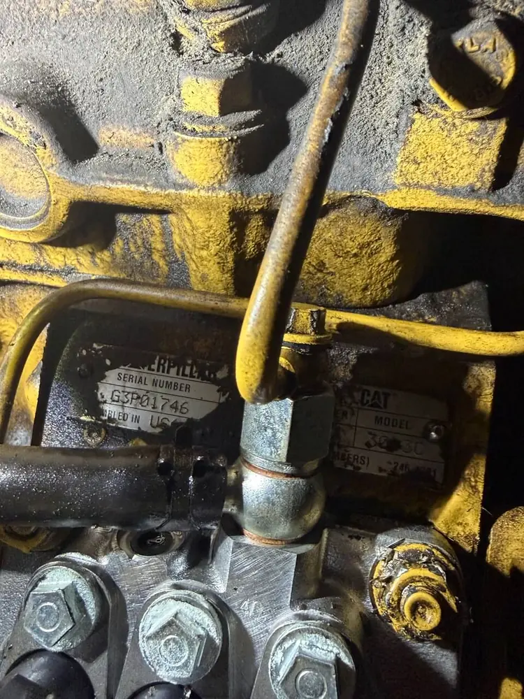 CAT diesel engine close-up during on-site powertrain work in Southwest Florida
