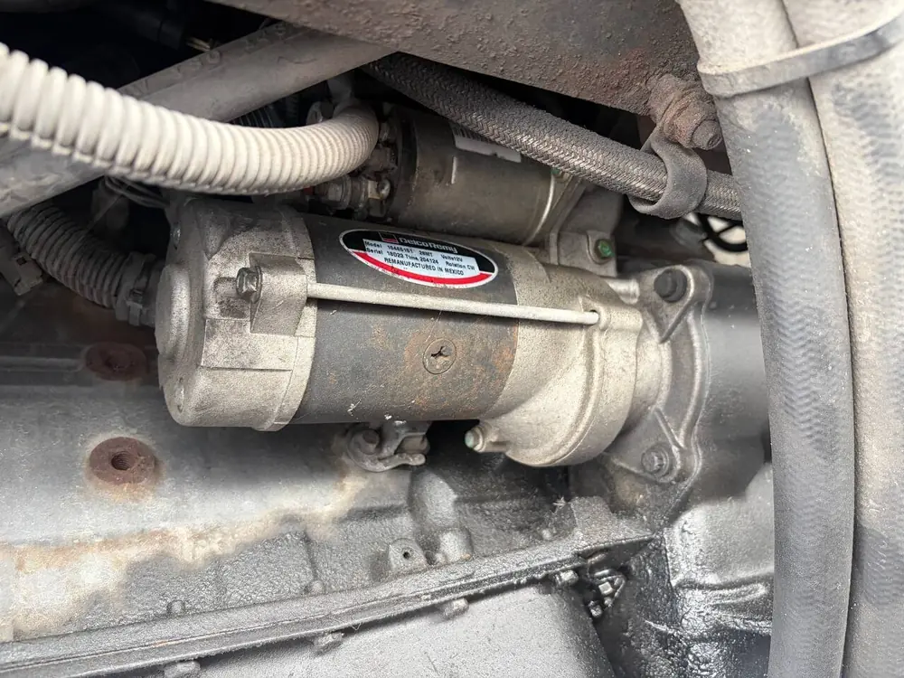 Starter motor close-up during mobile electrical repair